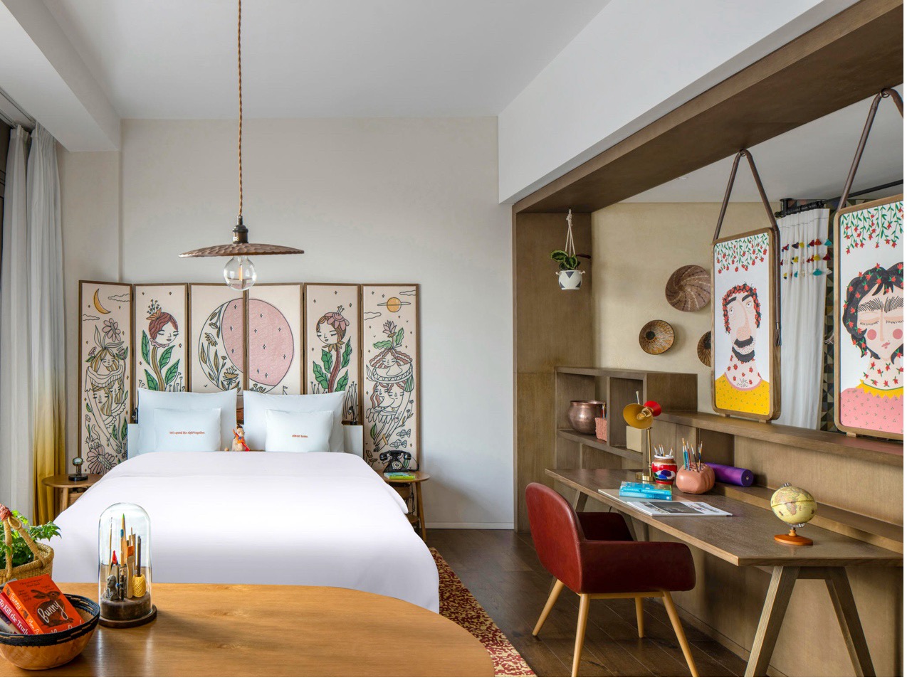 Hotel bedroom furniture layout with headboard and nightstands
